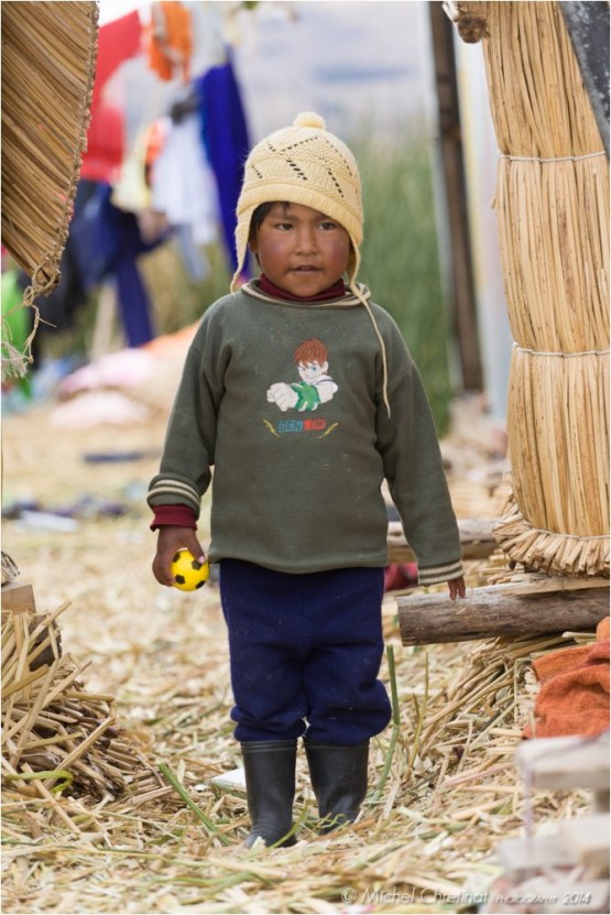 Aymara young boy on Uros floating Island of the Titicaca lake