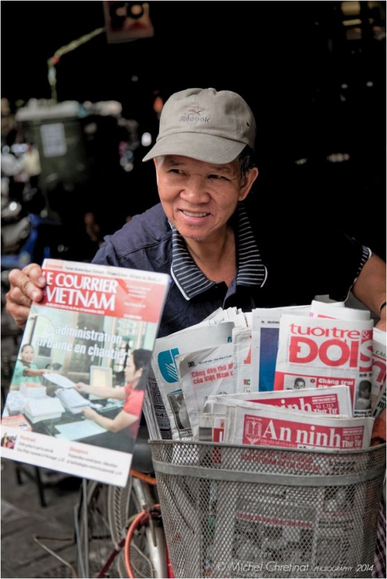 newspaper seller in Hanoï, Vietnam