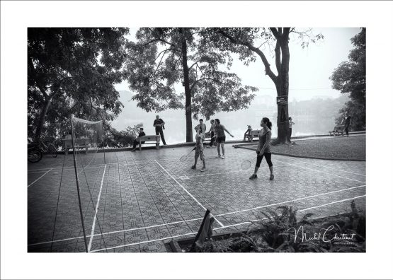 Badmington before work at Hoan Kiem Lake